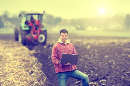 iStock_-_farmer_with_laptop_in_the_field