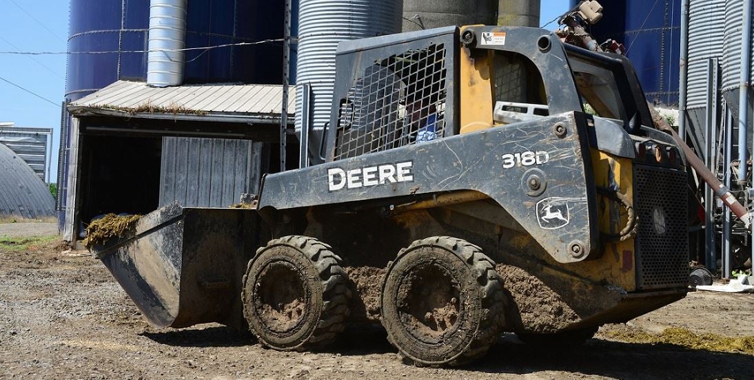 John Deere Skid Steer with Galaxy Muddy Buddy tires